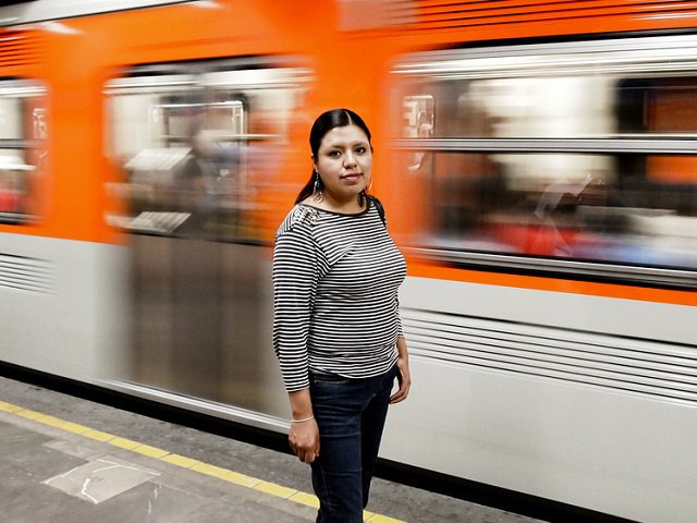 Picture of woman waiting on bus platform 